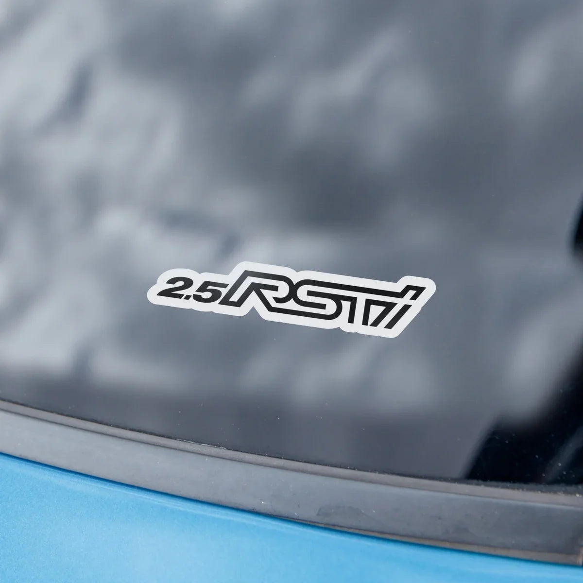 Black-and-white 2.5RSTI logo decal on a car window