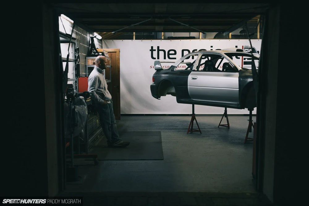 Jamie Flett beside the S5 WRC replica shell in The Project workshop.