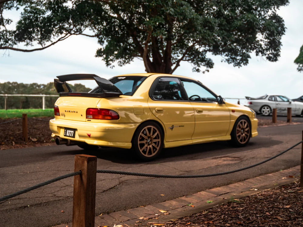 Richard yellow Club Spec Evo 4 GC8, rear three-quarter exterior view.