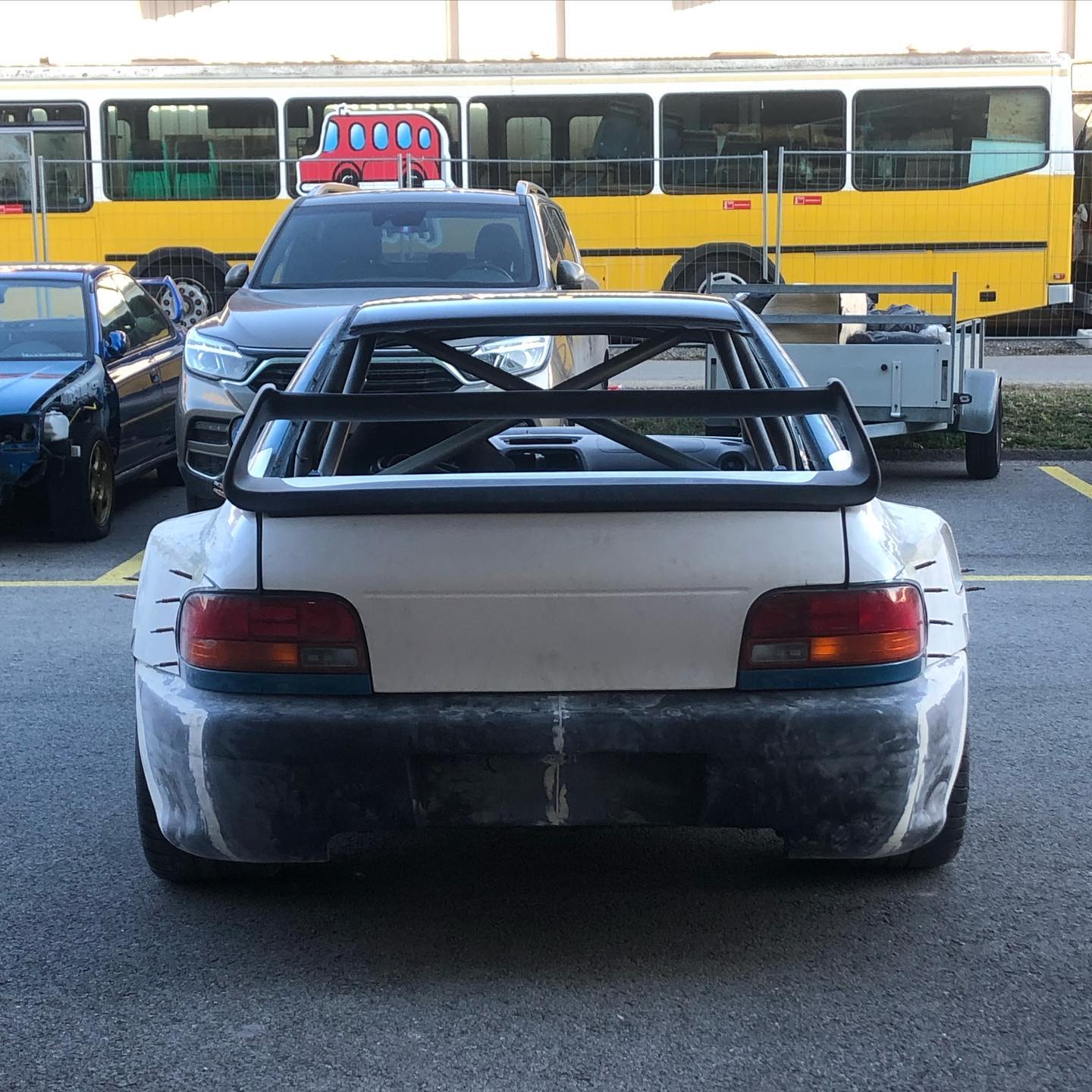 An unfinished Subaru project viewed from the rear